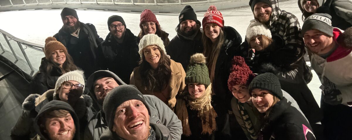 The Premier Pour Bartending crew and friends bundled up ready to ice skate at The Ribbon