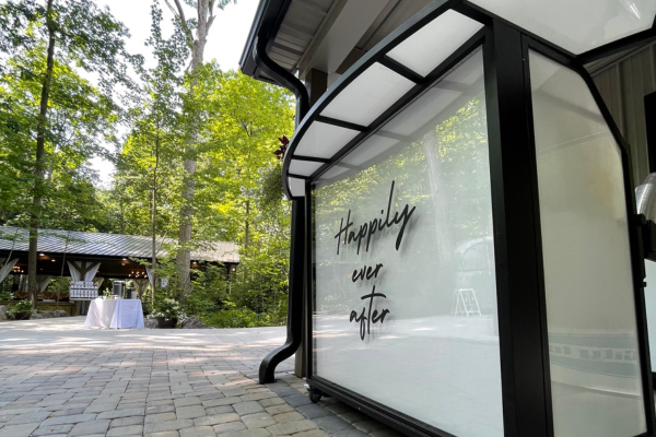 Custom portable bar with Happily Ever After wording on secluded wooded patio at Stillwaters Retreat in McComb, OH