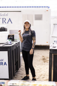 Bartender Lani with a hat on at Barefoot at the Beach 2024