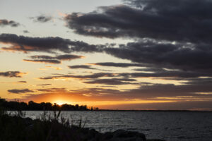 Beautiful sunset over Lake Erie with minor cloud cover during Barefoot at the Beach