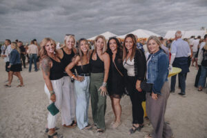 Group of female guests dressed up and attending Barefoot at the Beach