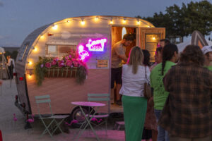 Photo booth trailer from Grand Lubell Photography on the beach at Barefoot at the Beach