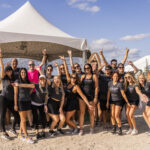 Large group of Premier Pour Bartending bartenders in a group before serving at Barefoot at the Beach