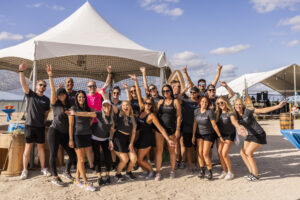 Large group of Premier Pour Bartending bartenders in a group before serving at Barefoot at the Beach